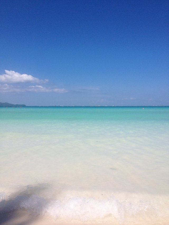 Clear as gin, fine as powder. This is a typical morning view of the beach in Boracay.