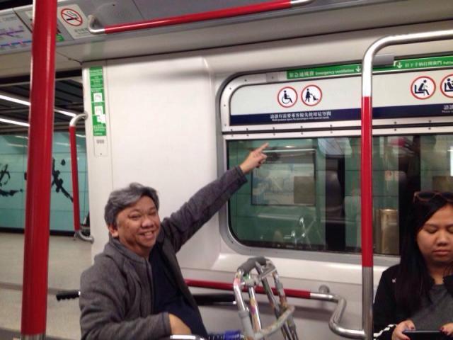 Papa conveniently commuting using the HK MTR