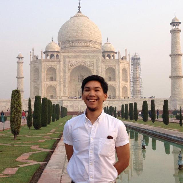 Posing in front of an iconic world heritage site, the Taj Mahal