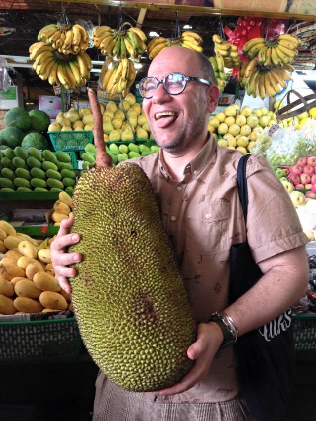 Jordi Butrón, presenter and purveyor of the EspaiSucre method, holding up a fruit during the Farmers Market Tour facilitated by Asia's Best Female Chef, Ms. Margarita Forés at their family-owned wet market in Cubao.