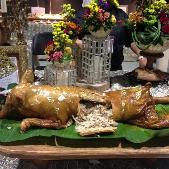 Rich man's lechon: decorated with gold leaf and stuffed with a decadent truffle rice.